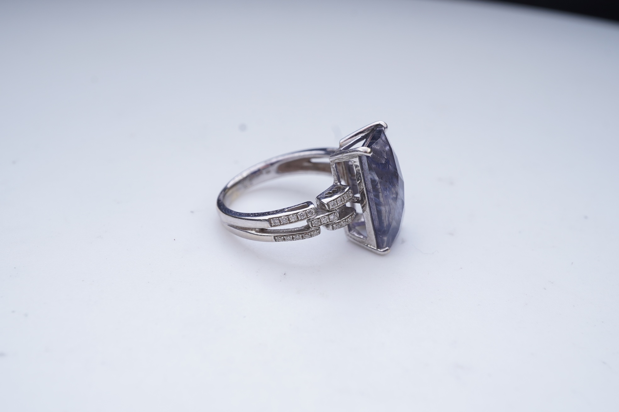 An iolite and diamond ring